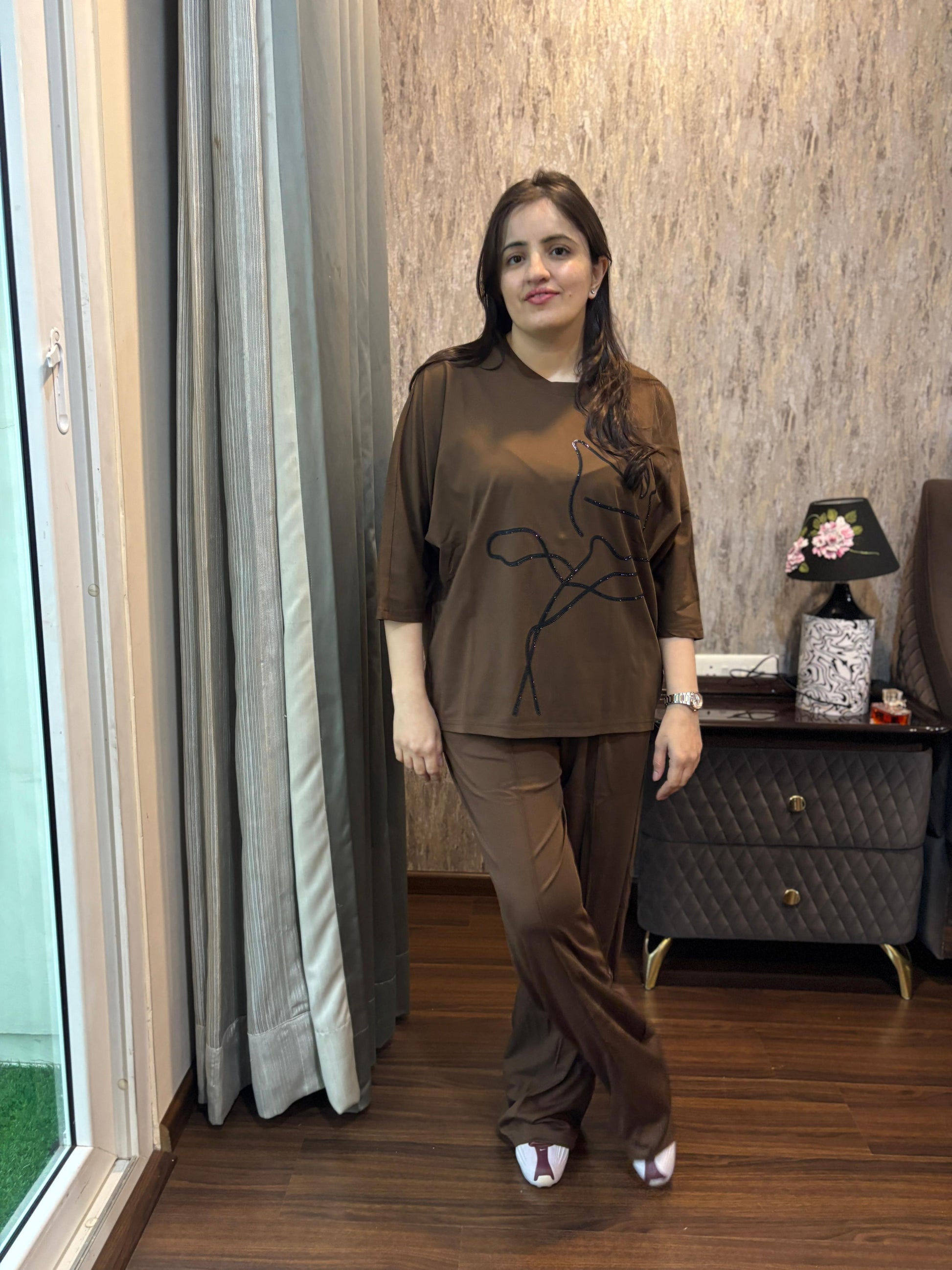 Luxury Coordset for Women - Model showcasing a stylish brown coord set with a unique design in a chic setting.